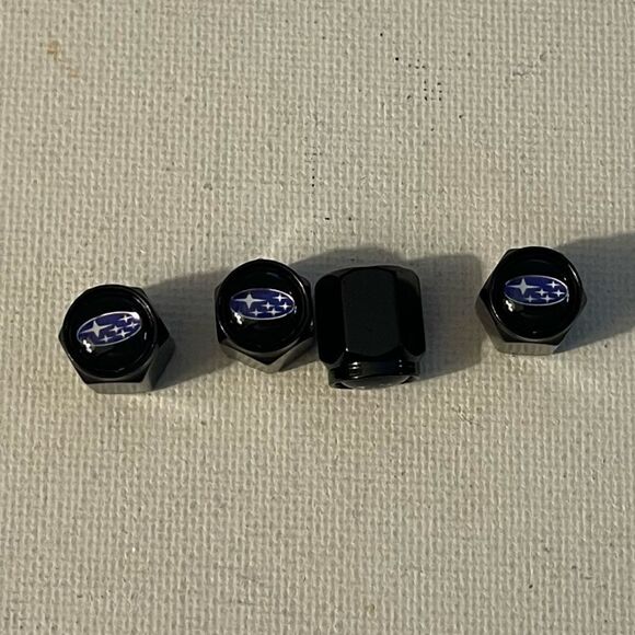 Subaru logo valve Stem caps in black set of 4 NWT - Picture 1 of 4